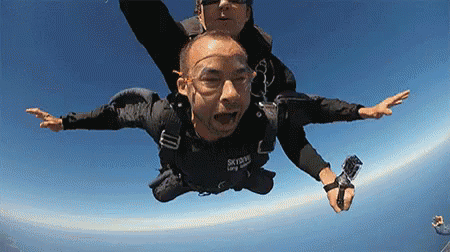 Man Flying in Black Skydive Shirt
