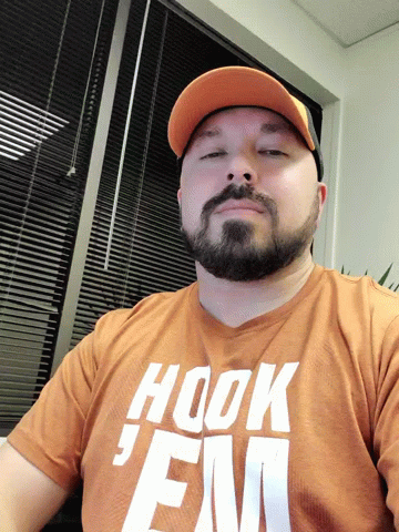 Man Gesturing Hook Em Sign GIF