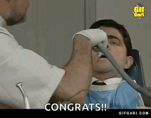 Man Getting Dental Exam Congrats