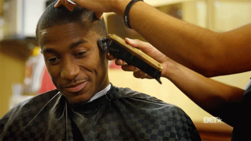 Man Getting Haircut From Woman Saying Bet