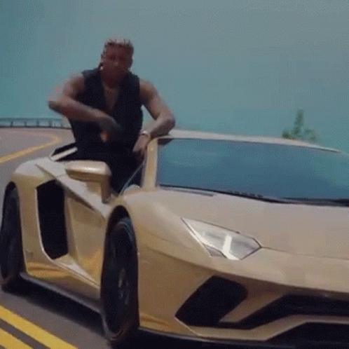 Man Getting Out of Sports Car