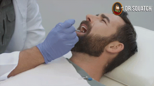 Man Getting Teeth Examined By Dentist With Dr. Squatch GIF