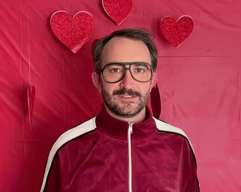 Man Giving Flowers And Hearts Happy Valentine's Day GIF