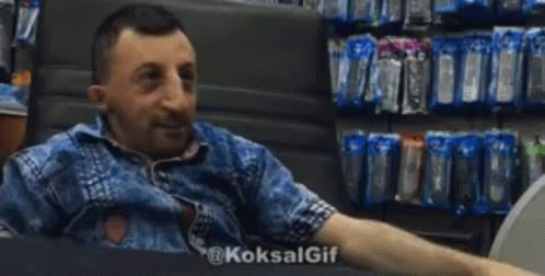 Man Giving High Five in Store Sitting in Chair