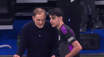 Man Giving Middle Finger to Man in Purple Audi Shirt