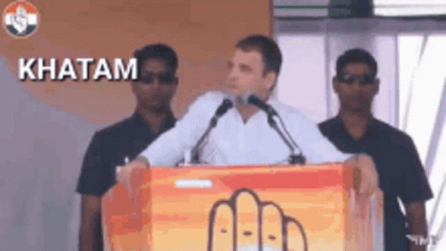 Man Giving Speech At Podium With Word Khatam GIF