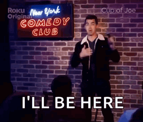 Man Giving Speech In Front Of Comedy Club Sign GIF