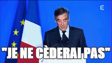 Man Giving Speech With Je Ne Cederai Pas GIF