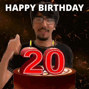Man Giving Thumbs Up in Front of Birthday Cake
