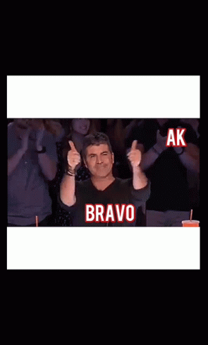Man Giving Thumbs Up With Bravo Screen GIF