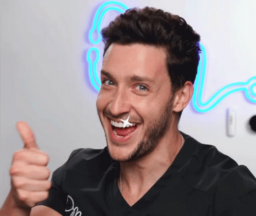 Man Giving Thumbs Up With Star On Face GIF