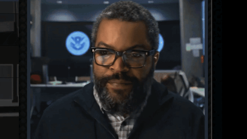 Man Glasses Beard U.S. Homeland Security Sign