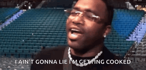 Man Glasses Chain Says Im Getting Cooked GIF