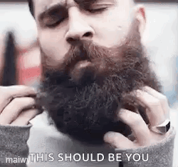 Man Grooming Beard with Comb
