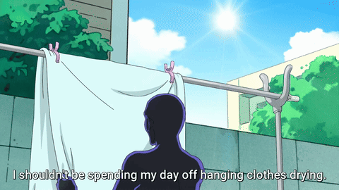 Man Hanging Clothes on Line