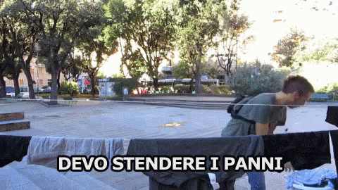 Man Hanging Clothes With Devo Stendere I Panni