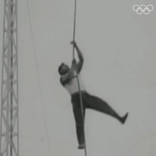 Man Hanging from Rope