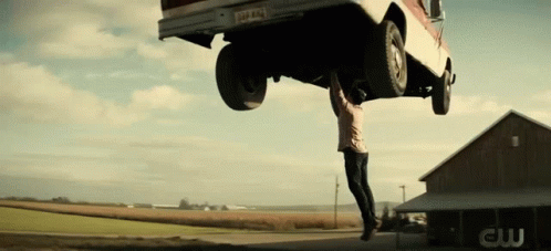 Man Hanging Upside Down From Truck