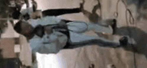 Man Hanging Upside Down with Microphone