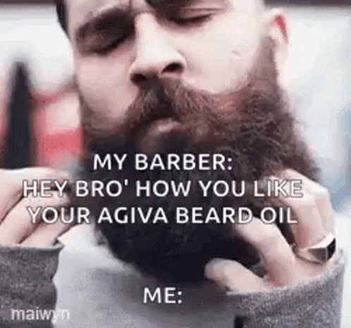 Man Having Beard Oil Applied