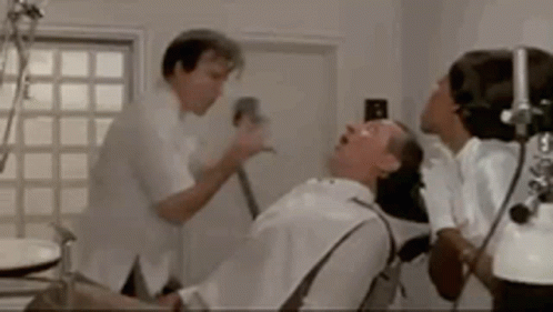 Man Having Dental Exam With Dentist And Nurse GIF