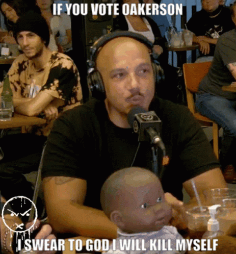 Man Headphones Holding Baby Doll Says If You Vote Oakerson