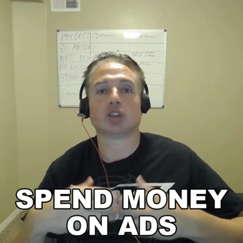 Man Headphones Says Spend Money On Ads Whiteboard GIF