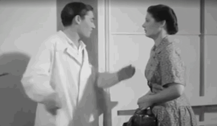 Man Helps Woman To Sit Down GIF