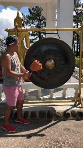Man Hitting Gong GIF