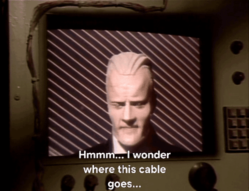 Man Hmm I Wonder Where This Cable Goes GIF