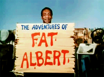 Man Holding A Fat Albert Poster GIF