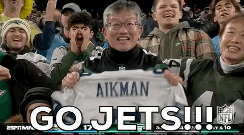 Man Holding Aikman Shirt Cheering For Jets GIF