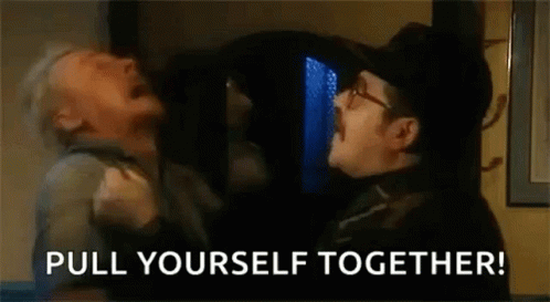 Man Holding Another Man Saying Pull Yourself Together