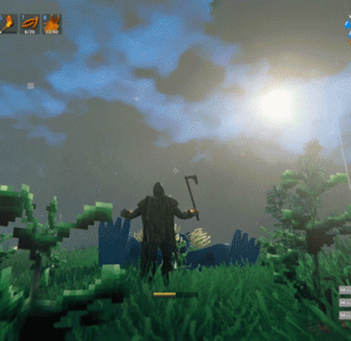 Man Holding Axe in Grass
