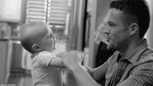 Man Holding Baby GIF