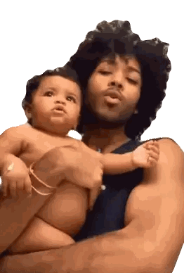 Man Holding Baby and Looking at Camera