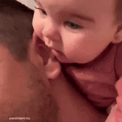 Man Holding Baby Biting Face
