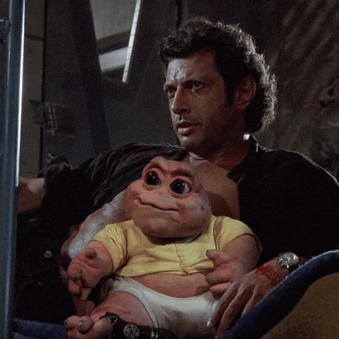 Man Holding Baby-Like Stuffed Animal