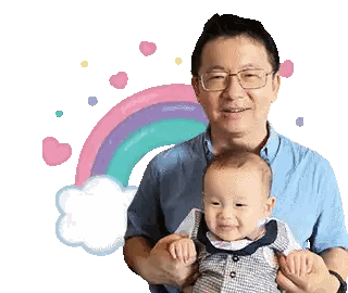 Man Holding Baby With Rainbow Background