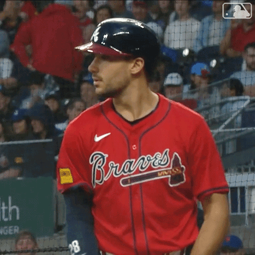 Man Holding Baseball Bat Braves Jersey