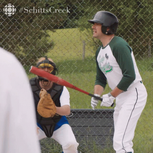 Man Holding Baseball Bat In Front Of Fence #Schitts Creek GIF