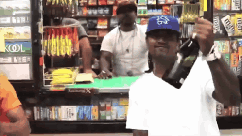 Man Holding Beer in Front of Kool Cooler