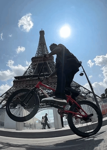 Man Holding Bike Over Head In Bike Race GIF