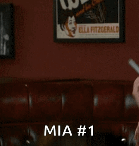 Man Holding Binder Says Mia #1