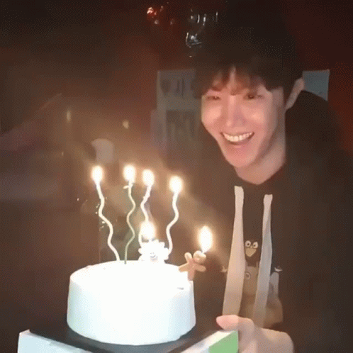 Man Holding Birthday Cake Smiling