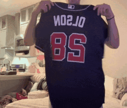 Man Holding Black Jersey Number 85