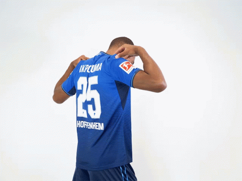 Man Holding Blue Jersey Number 25