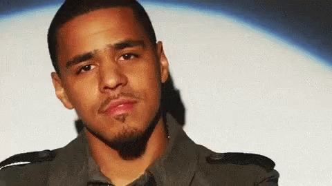 Man Holding Blue T.LA Shirt GIF