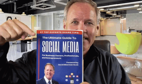Man Holding Book The Ultimate Guide To Social Media GIF