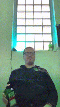 Man Holding Bottle By Window GIF